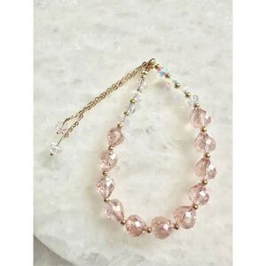 Bohemian style iridescent and light pink beaded friendship bracelet